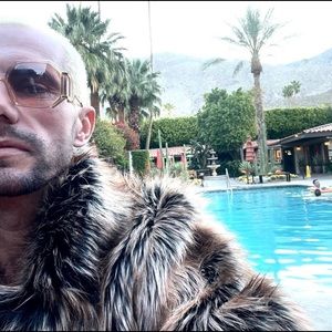 calf length barely worn faux fur coat